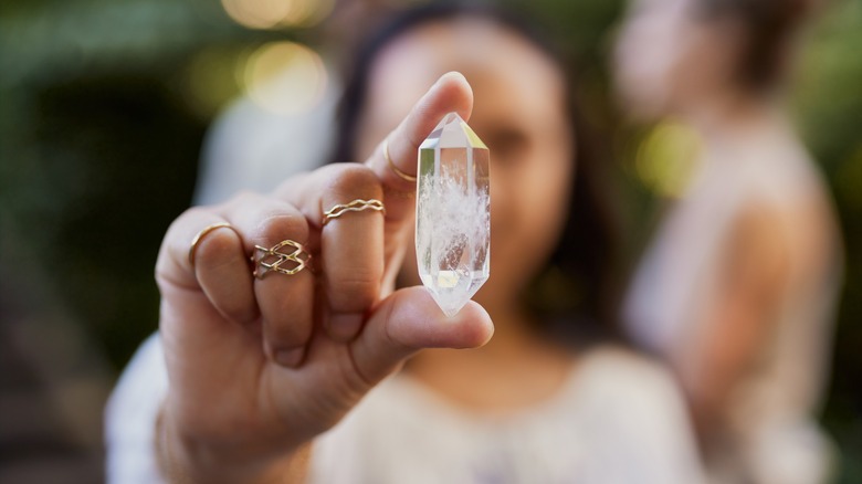 Woman holding a crystal